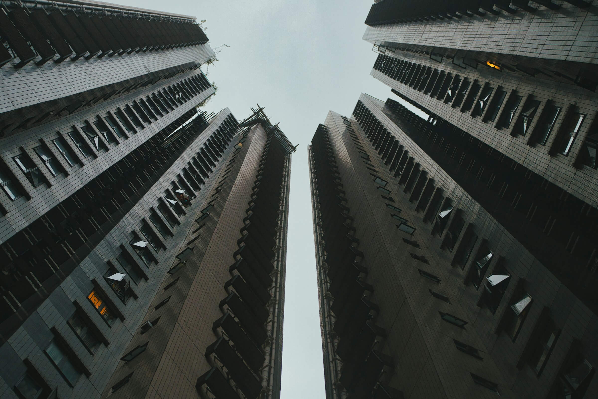 Tall modern high-rise buildings symbolizing corporate housing and business rental apartments in the city.