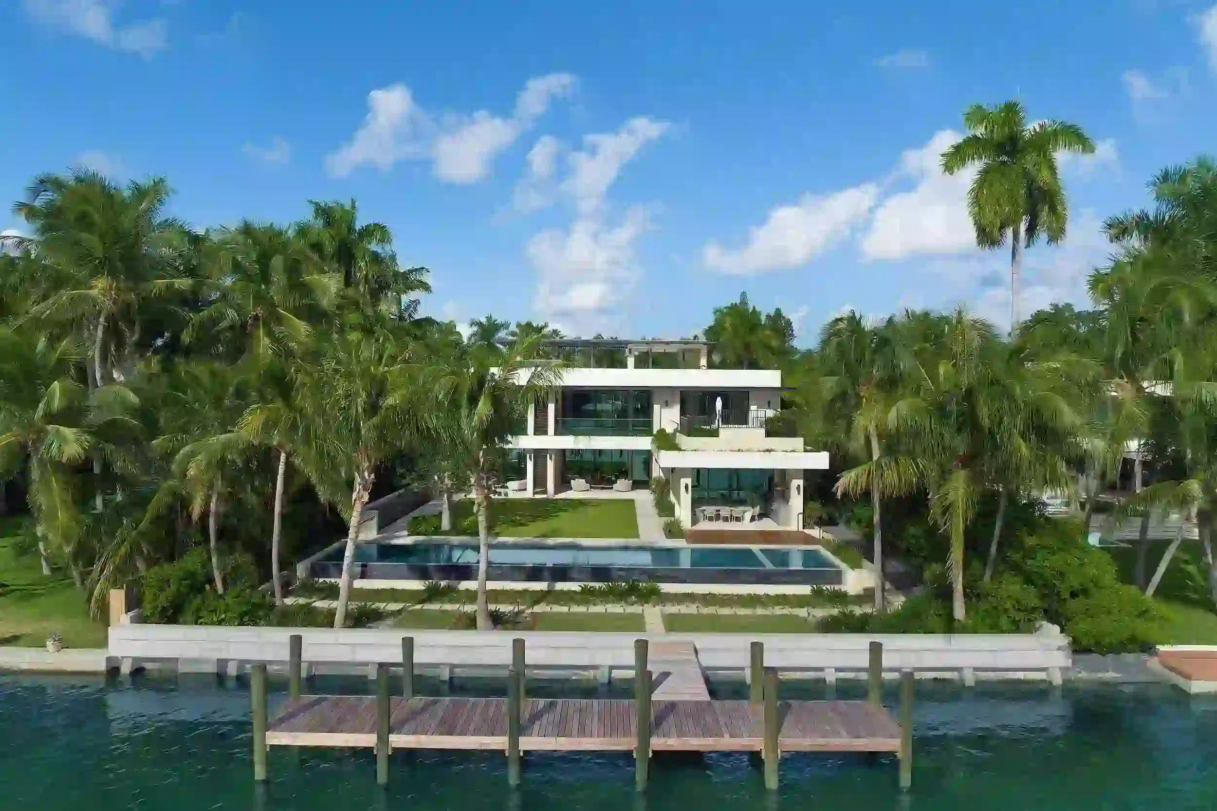 Luxury beachfront estate on Palm Island in Miami Beach with private dock and bay views