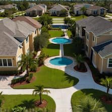 Kissimmee Orlando FL neighborhood with resort-style pool landscaped walkways and modern residential homes - Orlando, Florida houses for sale