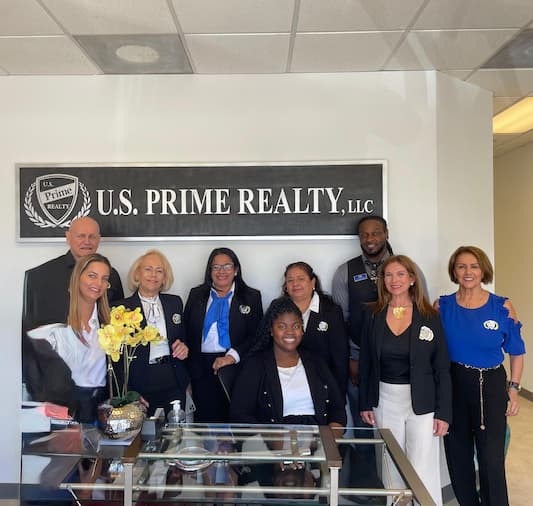 US Prime Realty expert agents in the Naples Office's lobby