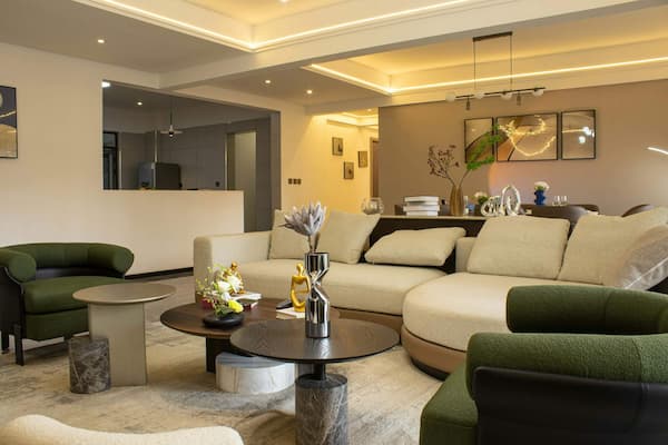 Modern living room interior with elegant furniture and warm lighting, symbolizing a downsizing strategy to a comfortable and stylish smaller home.